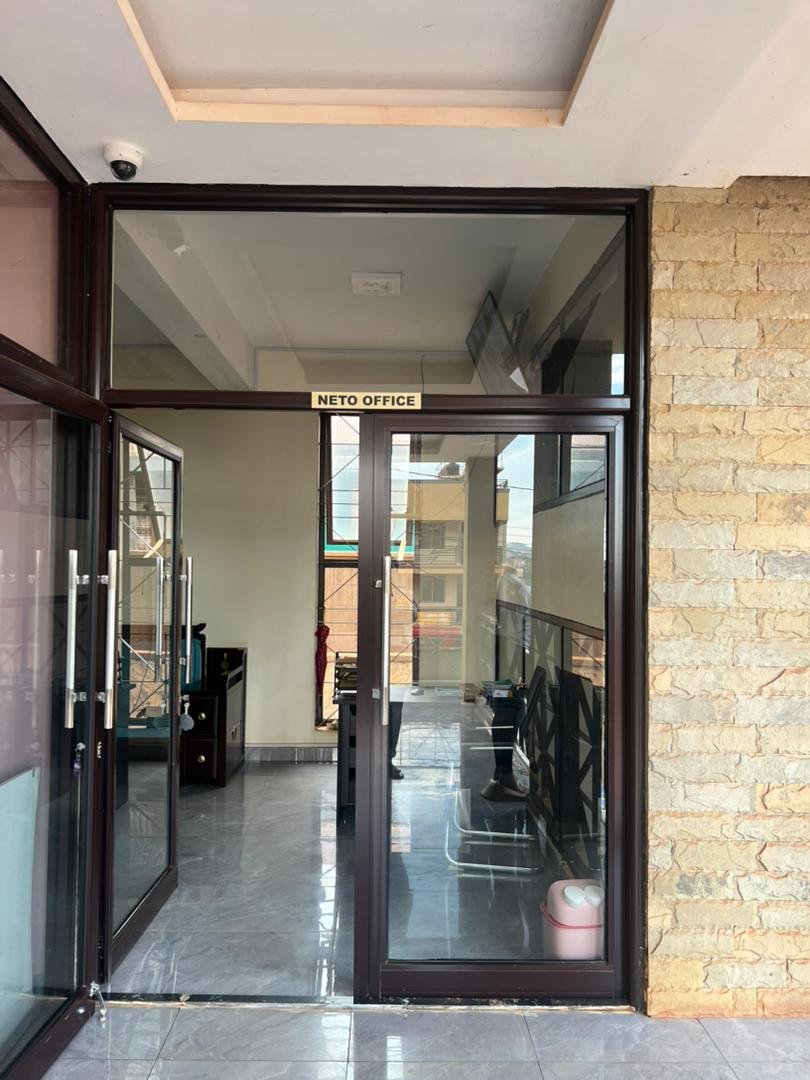 Interior corridor and shopfronts at Neto Mall